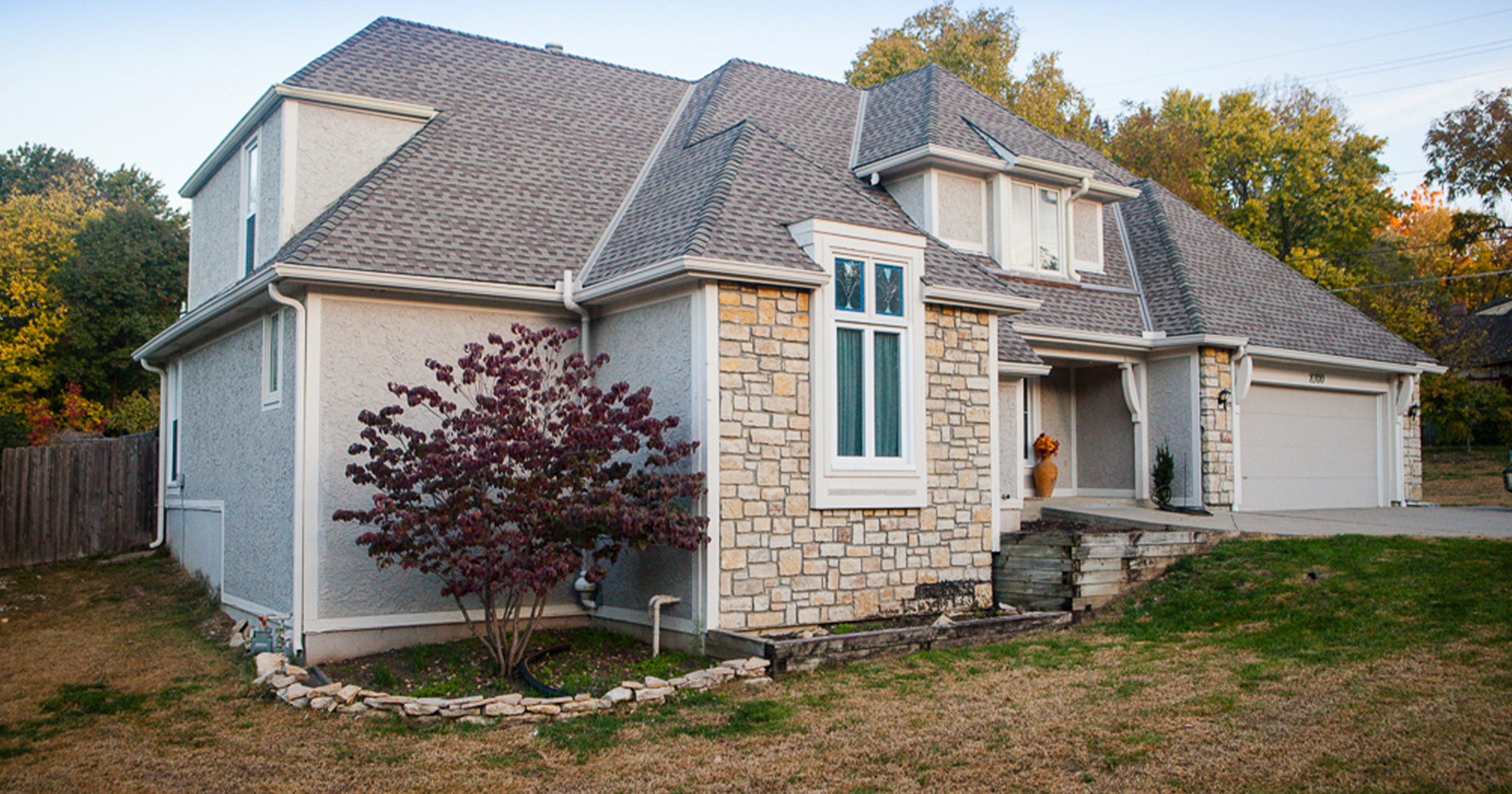 Two-story suburban house with gray siding